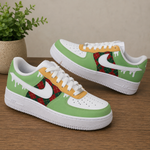 A pair of low-top Nike Air Force 1 style sneakers with a holiday theme. The shoes feature light green panels, white leather overlays and soles, yellow paint-drip details, and a red and green tartan plaid pattern on the side panels.